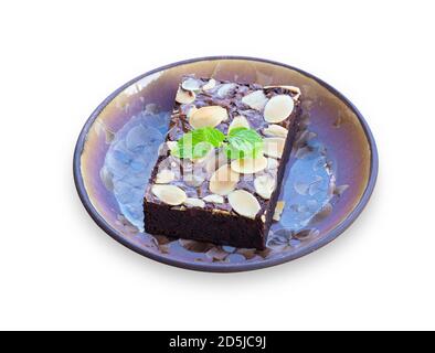 Homemade dark chocolate fudge brownies cake topping with almond slices on white isolated background with clipping path. Delicious bitter sweet and fud Stock Photo