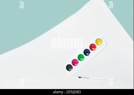 new clean palette of watercolors on geometric blue monochrome background, selective focus Stock Photo