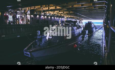 (PHILIPPINE SEA Oct. 6, 2020) Patrol Boats (PB) Mk VI assigned to Commander, Task Force 75 (CTF 75) embarked amphibious dock landing ship USS Comstock (LSD 45). Maritime Expeditionary Security Force and Explosive Ordnance Disposal Mobile Unit Sailors assigned to Commander, Task Force 75 (CTF 75) embarked and are conducting integrated littoral maritime security operations from the amphibious dock landing ship USS Comstock (LSD 45) with the Marines and Sailors already deployed as Task Force Ellis from I Marine Expeditionary Force. PB Mk VI provides increased capabilities to amphibious warships a Stock Photo