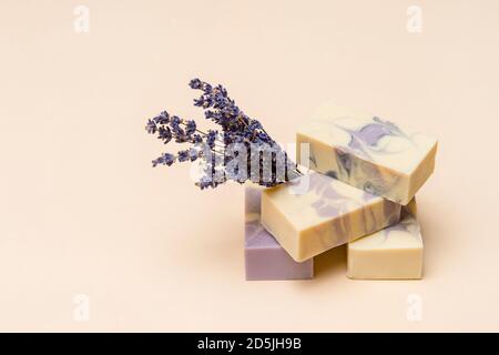 Natural handmade soap with dried lavender and essential oil on pink background. Zero waste concept Stock Photo