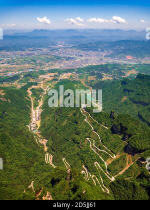 Aerial view of tianmen city with curve road to the mountain, China Stock Photo