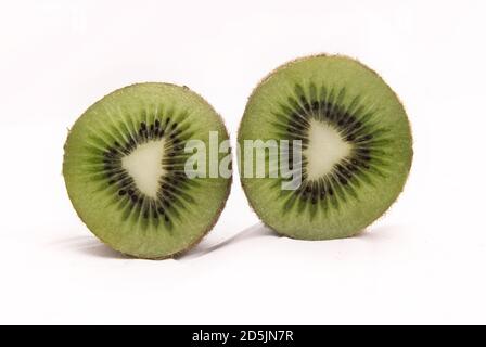Closeup of freshly sliced kiwi isolated on white background Stock Photo