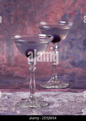 Aviation: a purple-bluish cocktail made with gin, maraschino, creme de violette and a dash of lemon juice, served with a maraschino cherry Stock Photo