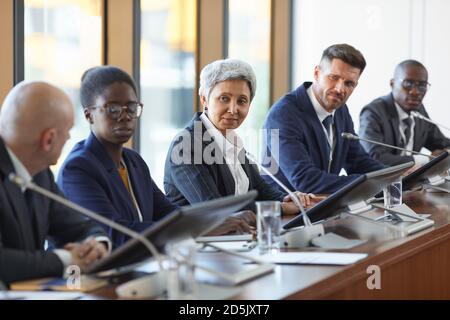 Group of business people discussing new project together in team during meeting at board room Stock Photo