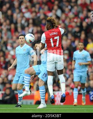 Manchester City's Samir Nasri (left) and Arsenal's Alex Song (right) battle for the ball Stock Photo