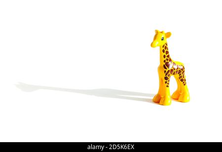 toy yellow giraffe ON A WHITE BACKGROUND, HORIZONTAL ORIENTATION, ISOLATED Stock Photo