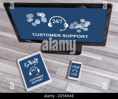 Customer support concept shown on different information technology devices Stock Photo