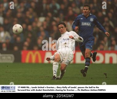 17-MAR-96.  Leeds United v Everton.  Gary Kelly of Leeds', passes the ball to the forward line with Andrei Kanchelskis chasing for Everton Stock Photo