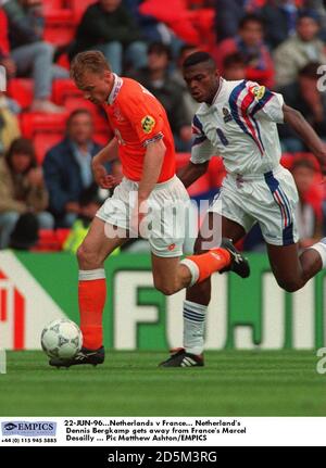 22-JUN-96. Netherlands v France.  Netherland's Dennis Bergkamp gets away from France's Marcel Desailly Stock Photo