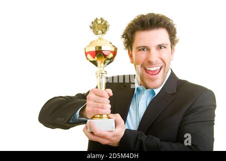 Young man in business clothes proudly celebrates with a trophy Stock Photo