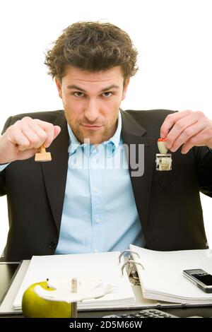 Young man in a suit is working at his desk Stock Photo