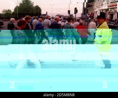 Police monitor spectators arriving at Forest's City Ground Stock Photo