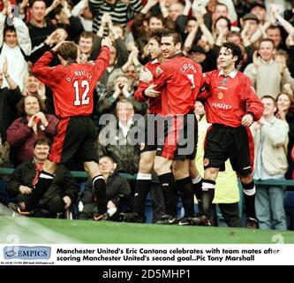 Manchester United's Eric Cantona celebrates with team mates after scoring Manchester United's second goal Stock Photo