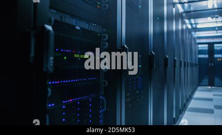 Close-up Shot of Data Center With Rows of Fully Operational Server Racks. Concept of Telecommunications, Cloud Computing, Artificial Intelligence Stock Photo