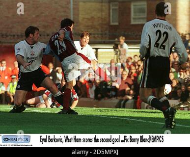 Eyal Berkovic of West Ham United (centre) scores the second goal despite the attentions of Bolton Wanderers' Gerry Taggart (left) and Mike Whitlow (right) Stock Photo