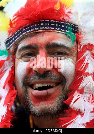 An Atletico Madrid fan shows his support before the game  Stock Photo