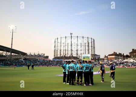 The Surrey team gather together on the outfield as Glamorgan walk out to start their innings  Stock Photo