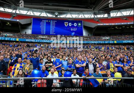 AFC Wimbledon fans show their support in the stands. Stock Photo