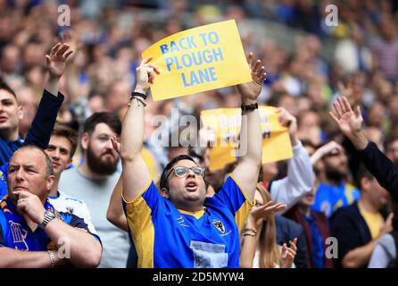 AFC Wimbledon fans show their support in the stands. Stock Photo