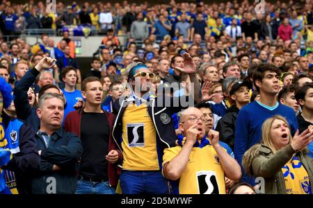 AFC Wimbledon fans show their support in the stands. Stock Photo