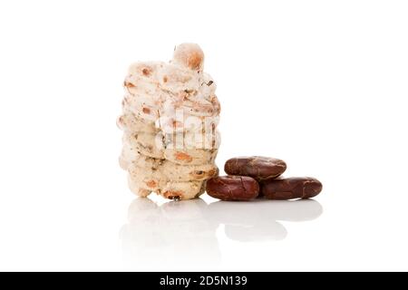 Raw cocoa beans and fresh roasted beans isolated on white background. Stock Photo