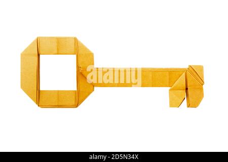 Origami paper golden key on a white background Stock Photo
