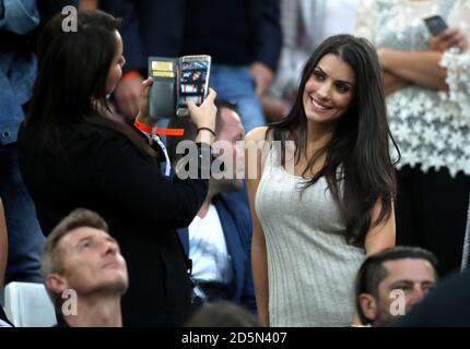 Ludivine Sagna, wife of France's Bacary Sagna (right) poses for a photo in the stands before the game  Stock Photo