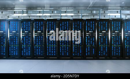 Shot of a Working Data Center With Rows of Rack Servers. Led Lights Blinking and Computers are Working. Stock Photo