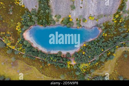 Glenmore, Scotland, UK. 14 October 2020. Autumn aerial view of An Lochan Uaine more commonly known as the Green Loch due to the striking green colour of it’s water in Cairngorms National Park.  Iain Masterton/Alamy Live News