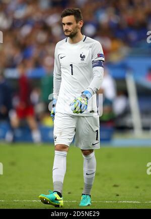 France goalkeeper Hugo Lloris looks to Spain's Xabi Alonso as he ...