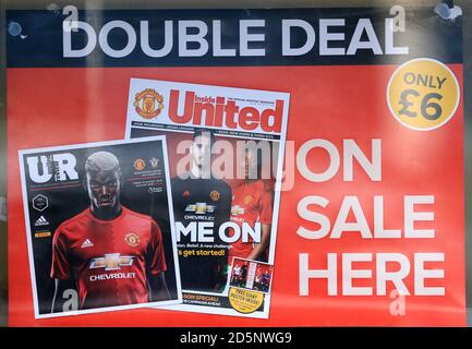 Manchester United match day programme featuring Paul Pogba on the front cover on sale before the game against Southampton. Stock Photo