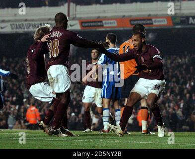 Arsenal's Thierry Henry celebrates scoring their first goal of the game with teammate Kerra Gilbert Stock Photo