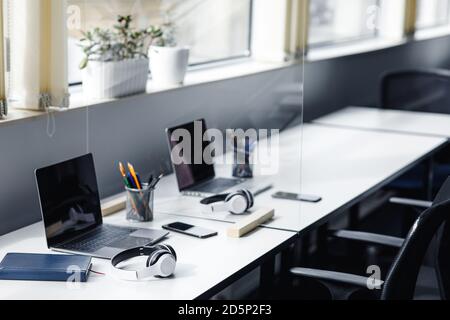 Coworking office interior, employees left room for meeting or break, nobody Stock Photo