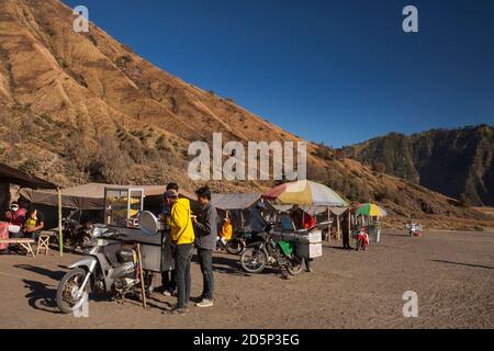 Horizontal view of some food stalls over motorbikes around Mt Bromo,   Bromo - Tengger - Semeru National Park, Java, Indonesia Stock Photo