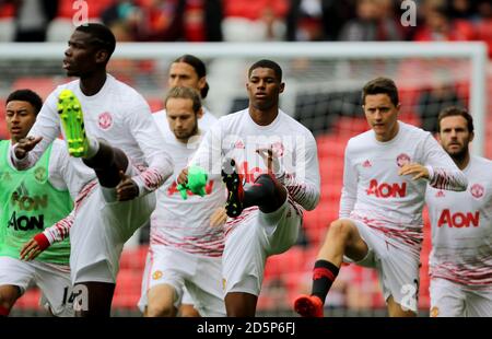 Manchester United's Marcus Rashford (centre) warms-up Stock Photo