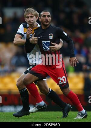 Port Vale's Nathan Smith and Coventry City's Marcus Tudgay Stock Photo