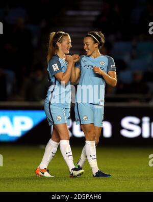 Manchester City's Lucy Bronze (right) celebrates scoring her side's second goal with team-mates Stock Photo