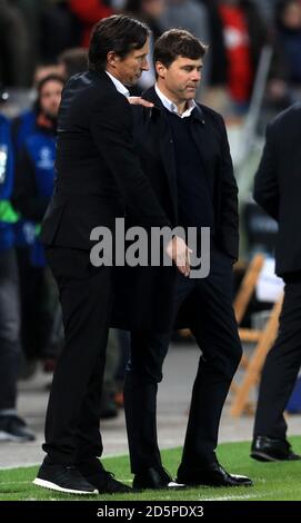 Bayer Leverkusen's Roger Schmidt talks to Tottenham Hotspur manager Mauricio Pochettino on the sidelines Stock Photo