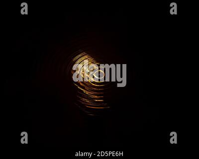 Abstract illustration of golden spirals on a black background. Stock Photo