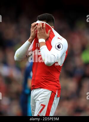 Arsenal's Alexis Sanchez looks dejected after a missed opportunity on goal Stock Photo