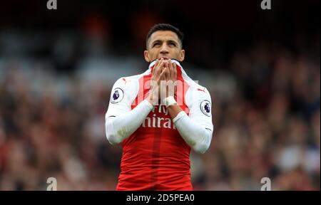 Arsenal's Alexis Sanchez looks dejected after a missed opportunity on goal Stock Photo