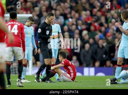 Referee Mark Clattenburg sends off Manchester United's Ander Herrera after his 2nd yellow card Stock Photo
