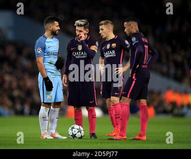 Manchester City's Sergio Aguero (left) with Barcelona's Lionel Messi (second left) and Neymar (right) Stock Photo