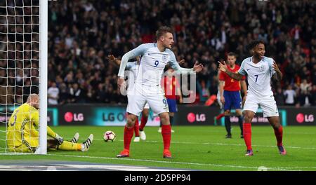 England's Jamie Vardy (left) celebrates scoring his side's second goal with Raheem Sterling Stock Photo