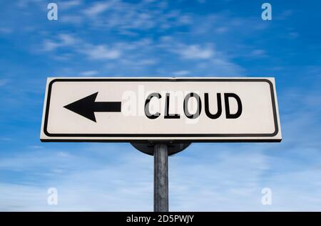 Cloud road sign, arrow on blue sky background. One way blank road sign with copy space. Arrow on a pole pointing in one direction. Stock Photo
