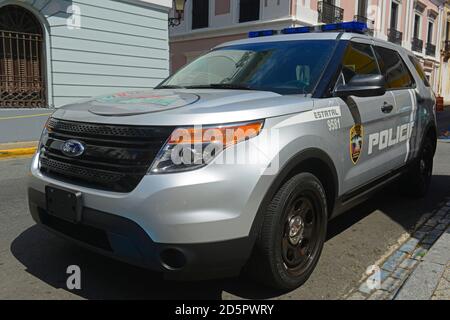 San Juan Police Car on Plaza de Armas in Old San Juan, Puerto Rico. Stock Photo