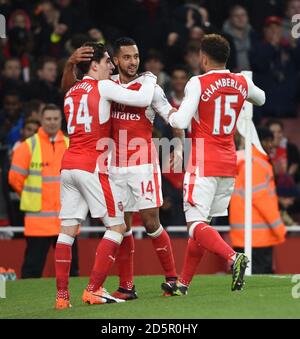 Arsenal's Theo Walcott (centre) celebrates scoring their first goal with Hector Bellerin (left) and Alex Oxlade-Chamberlain Stock Photo