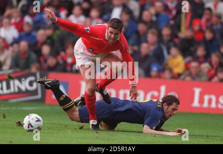 L-R;  Andy Gray, Nottingham Forest jumps over the challenge of Ben Thatcher, Wimbledon Stock Photo