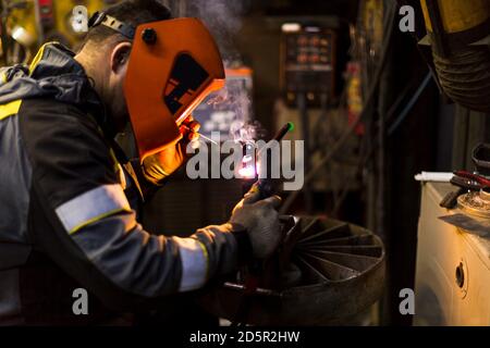 TIG welding of aluminum part for a passenger car Stock Photo