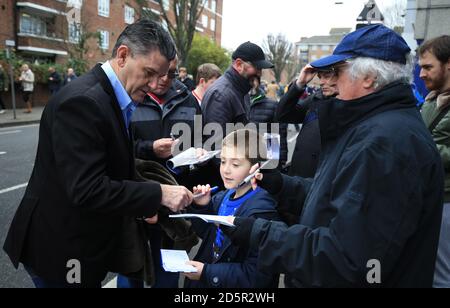 Former Queens Park Rangers' and Aston Villa's player and manager, John Gregory signs autographs before the game. Stock Photo